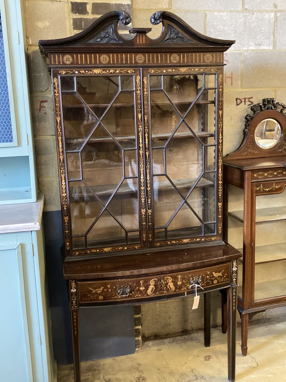 An Edwardian marquetry inlaid mahogany bow front display cabinet, width 92cm, depth 47cm, height 196cm